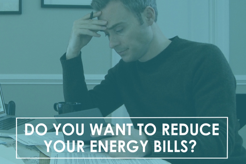 Do You Want to Reduce Your Energy Bills? - Man crunches numbers at his table.